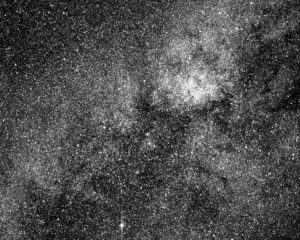 Black and white image of stars and nebulae