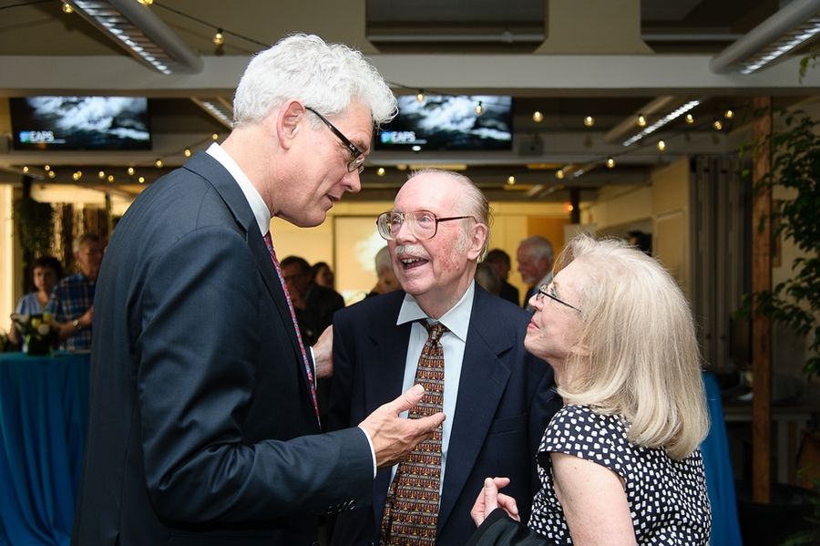 Photo of Robert van der Hilst talking with Peter H. Stone and Paola Malanotte-Rizzoli at a party