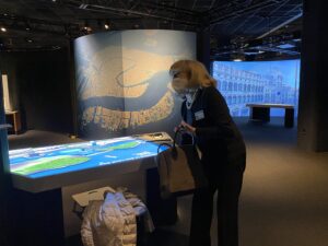 MIT professor inspects images of Venice in museum exhibit hall