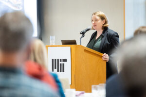 Noelle Selin speaks from MIT podium