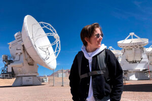 Jess Speedie in front of large white radio disc